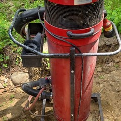 Red Wheeled Industrial Canister Vacuum Unit with Hose Attachment Included