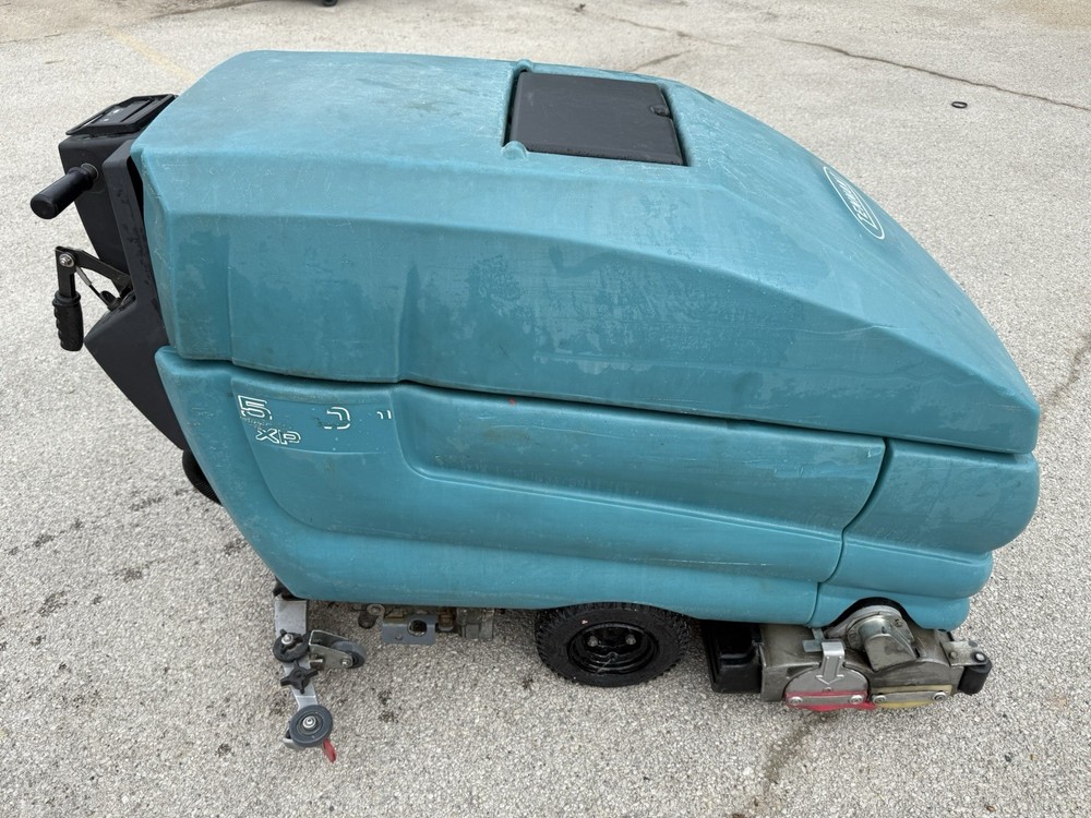 TENNANT 5700 XP SCRUBBER.On a pallet ready for pick up or shipping paid by buyer