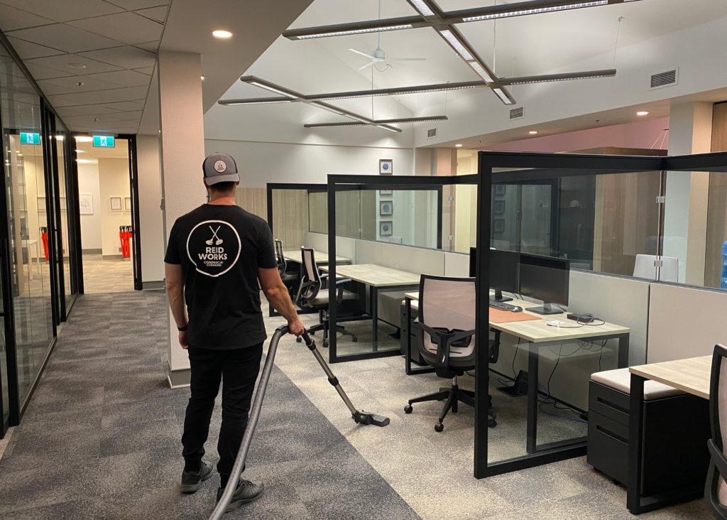 cleaner cleaning an office